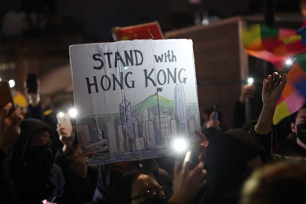 Hong Kong pro-democracy protesters taking part in a Hong Kong solidarity rally in Trafalgar Square, London