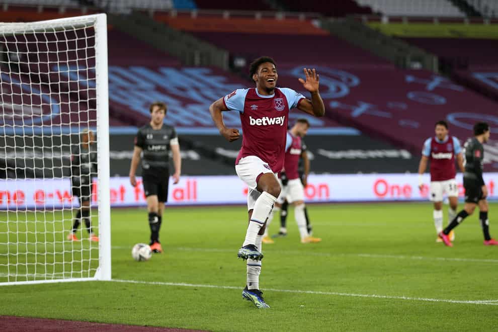 Oladapo Afolayan celebrates scoring for West Ham against Doncaster