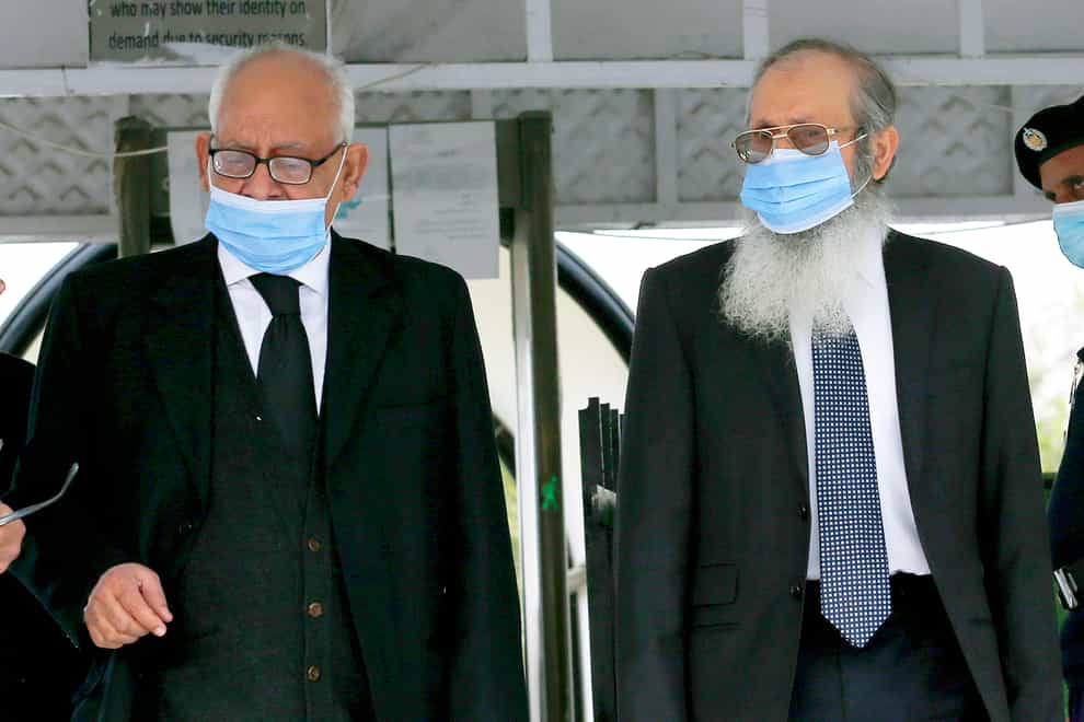 Ahmed Saeed Sheikh, right, father of Ahmed Omar Saeed Sheikh, leaves court with his lawyer