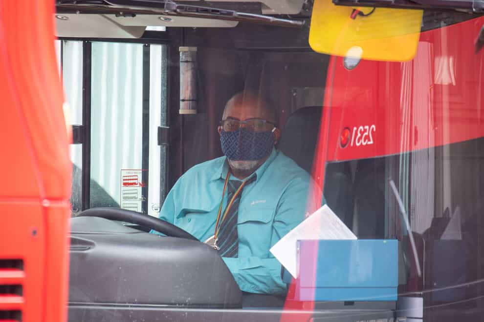 A bus driver in his cab