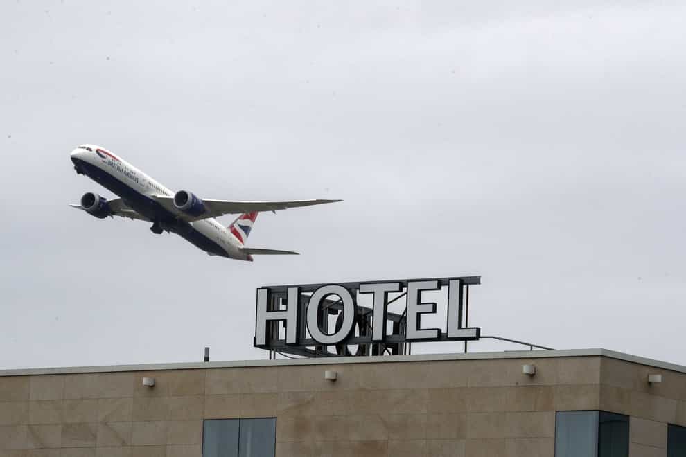 A plane passes over the Sofitel Hotel at Heathrow.