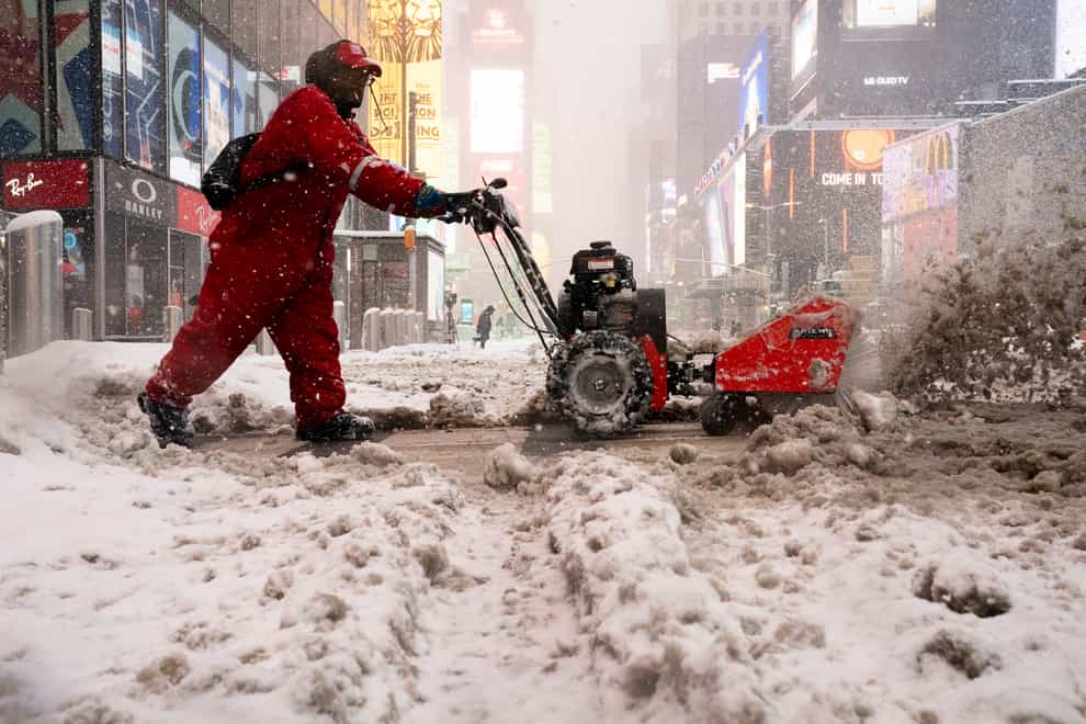 Snow is cleared in Times Square, New York