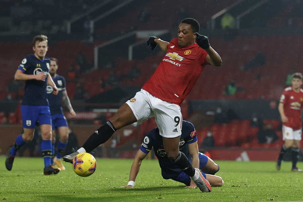 Manchester United’s Anthony Martial stretches his leg for the ball before scoring their side’s fifth goal of the game