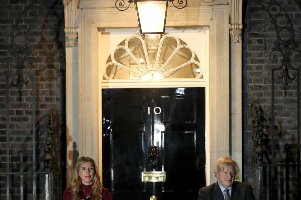 Carrie Symonds and Prime Minister Boris Johnson clap outside 10 Downing Street