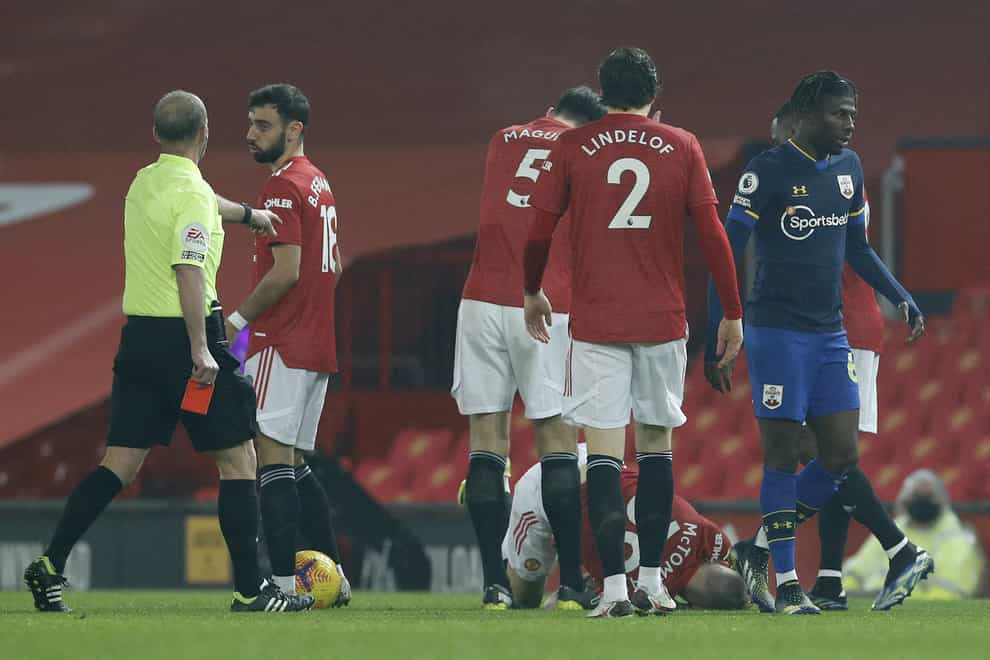 Southampton’s Alex Jankewitz, right, leaves the pitch after being shown a red card