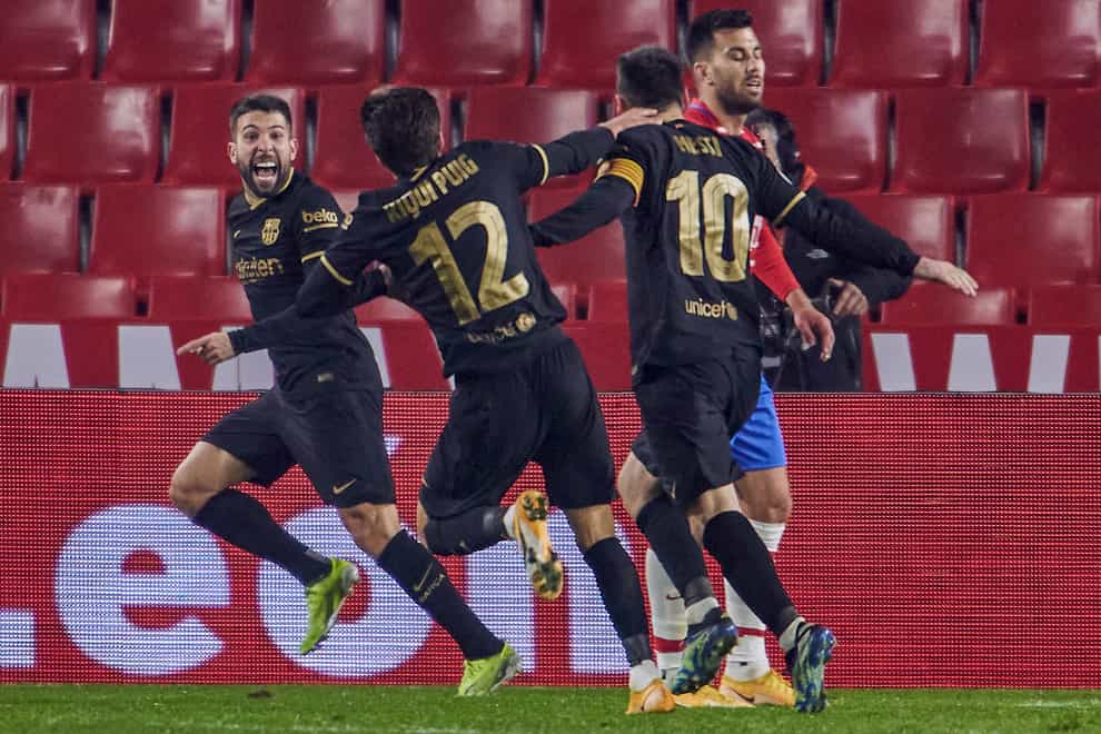 Barcelona’s Jordi Alba celebrates after scoring his side’s fifth goal against Granada