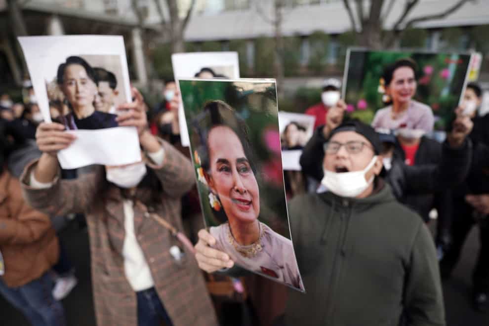 Burmese living in Japan and supporters hold pictures of Myanmar leader Aung San Suu Kyi