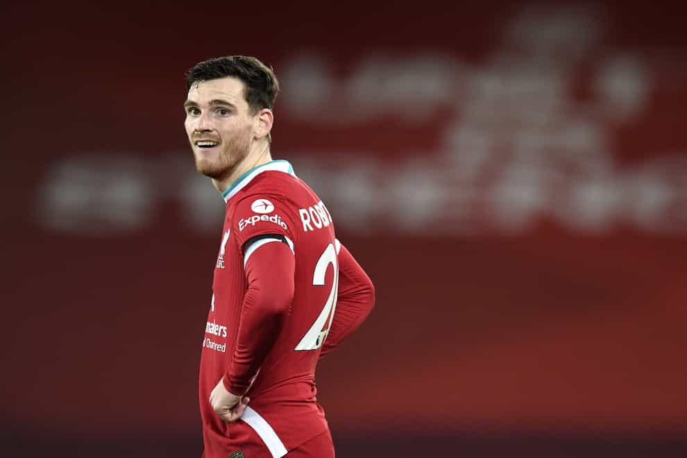 LIverpool defender Andy Robertson stands with his hands on his hips