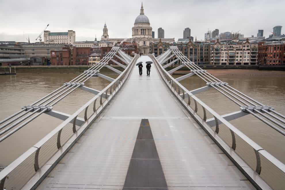 An almost deserted Millennium Bridge near St Paul’s Cathedral in central London during England’s third national lockdown