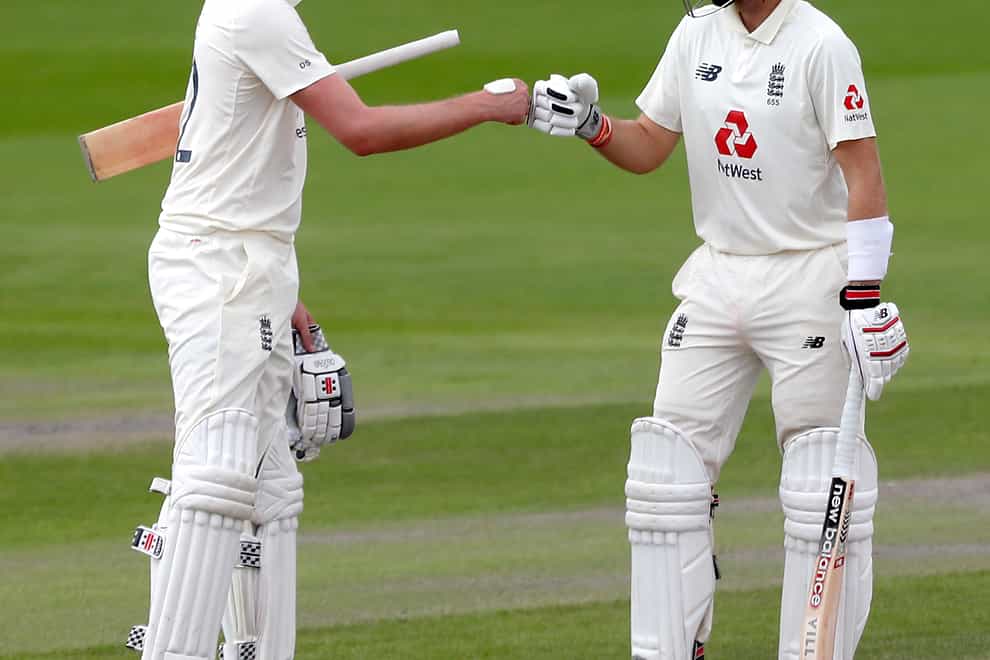 Joe Root (right) and Dom Sibley frustrated India