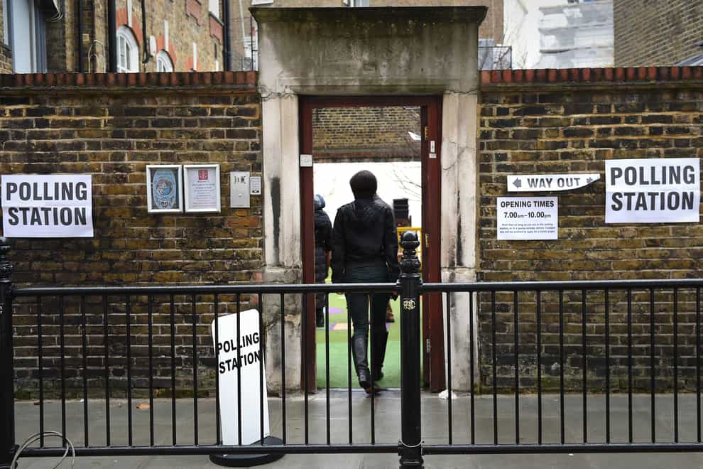 A person arrives at a polling station in South Kensington