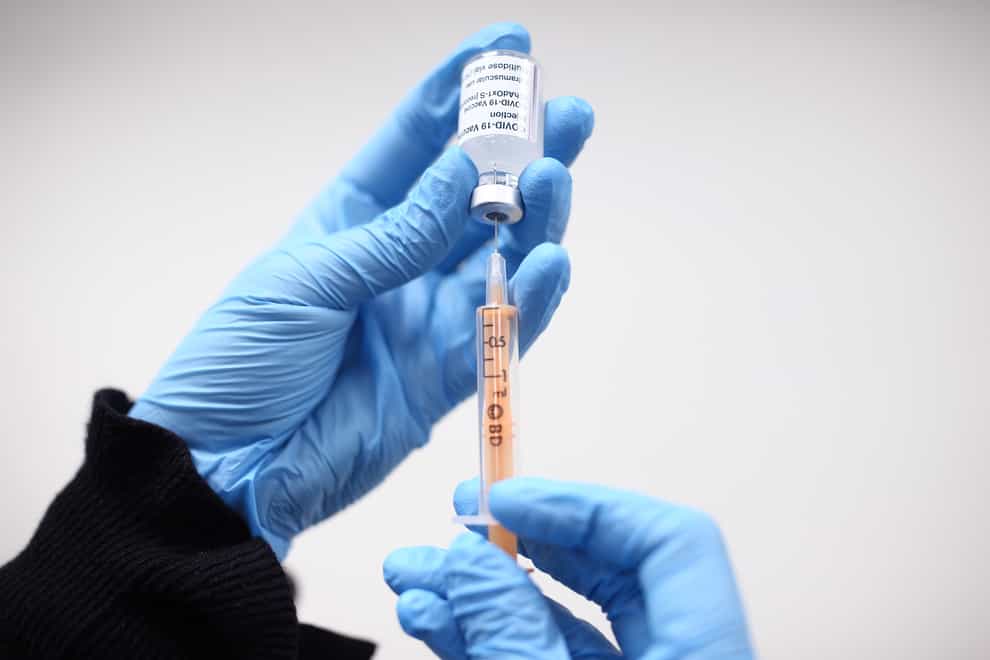 Healthcare worker handling vaccine