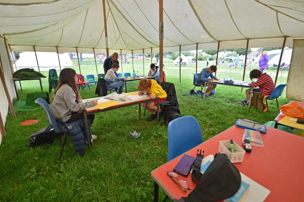 A socially distanced classroom setting last year in a tent outside on the school playing fields at Llanishen Fach Primary School in Cardiff (Ben Birchall/PA)