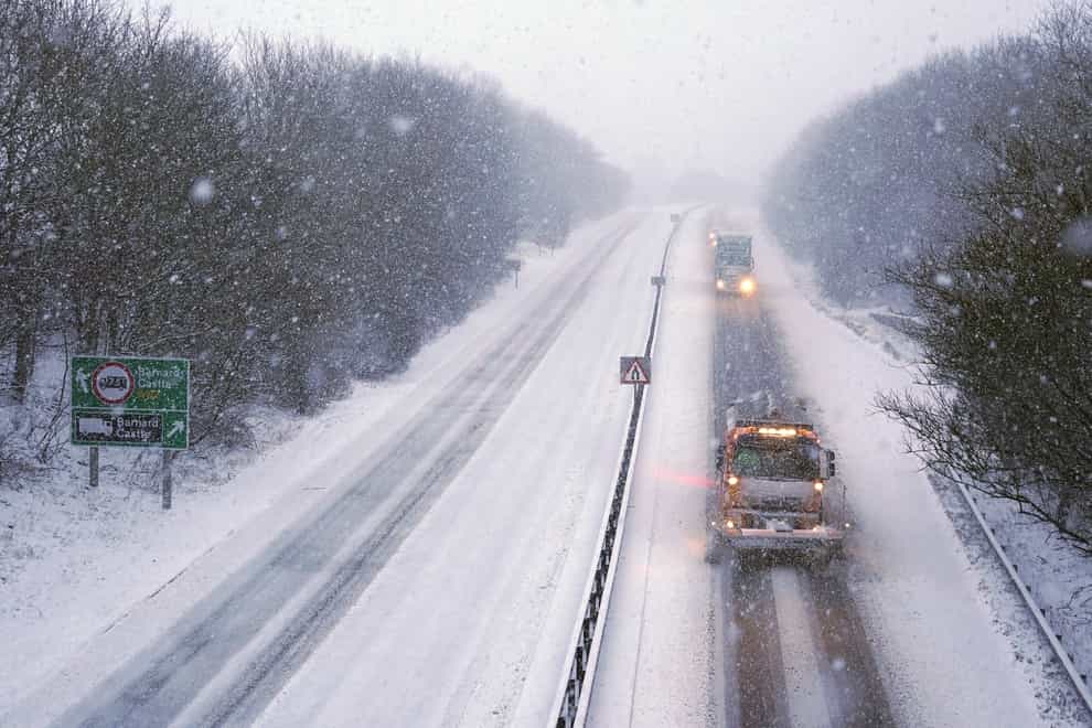 A snowplough keeps the A66 open at Bowes in County Durham