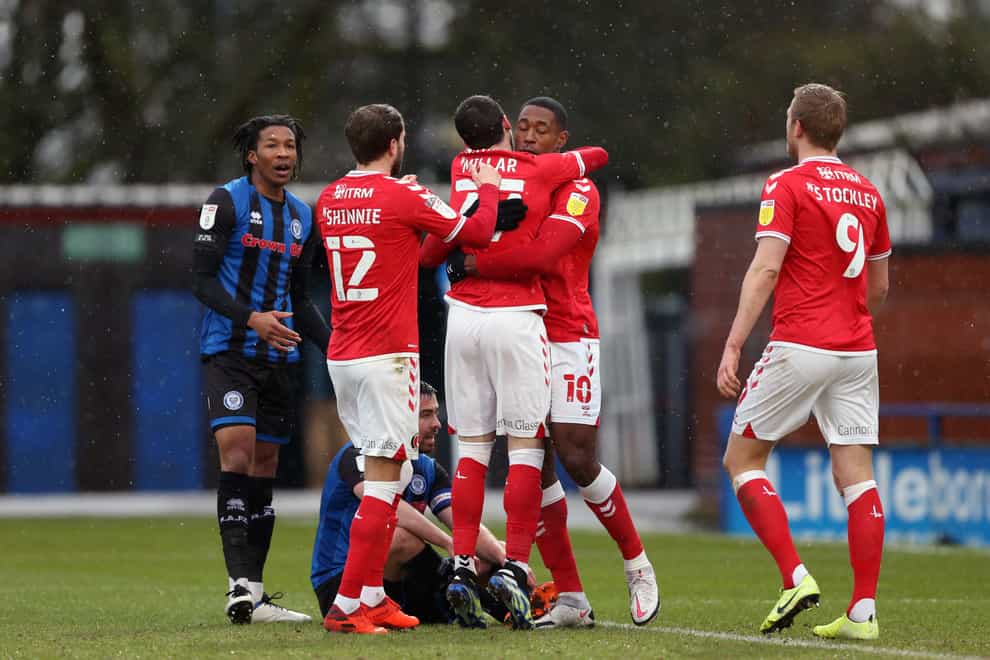 Chuks Aneke (second right) celebrates scoring the opening goal against Rochdale