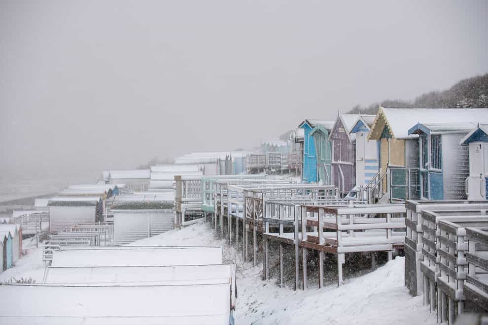 Snow-covered beach huts at Walton-on-the-Naze in Essex