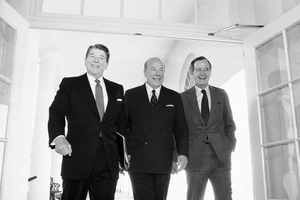 George Shultz, centre, with Ronald Reagan and George Bush