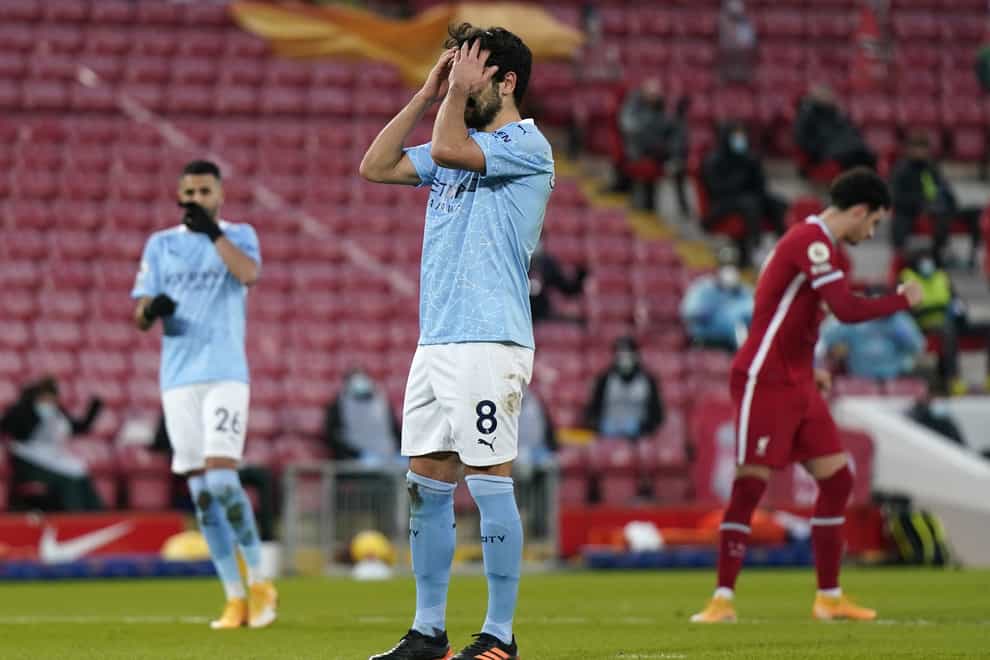 Ilkay Gundogan has his head in his hands after missing a penalty