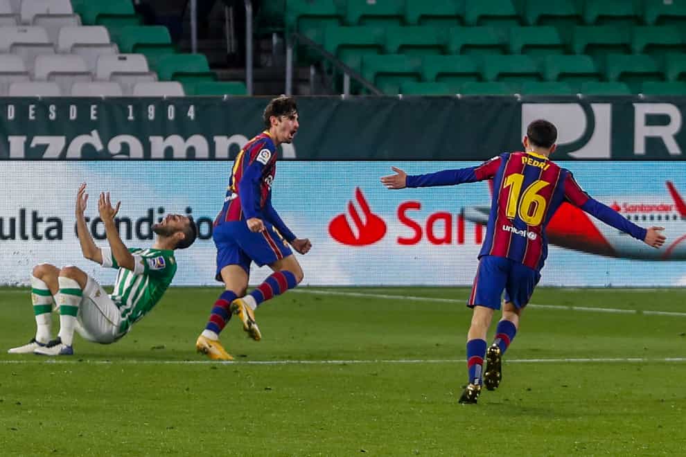 Francisco Trincao celebrates after scoring the winner for Barcelona away to Real Betis