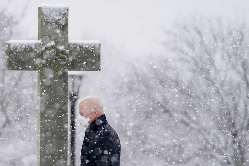 President Joe Biden departs after attending Mass at St Joseph on the Brandywine Catholic Church in Wilmington, Delaware as snow falls (Patrick Semansky/AP)
