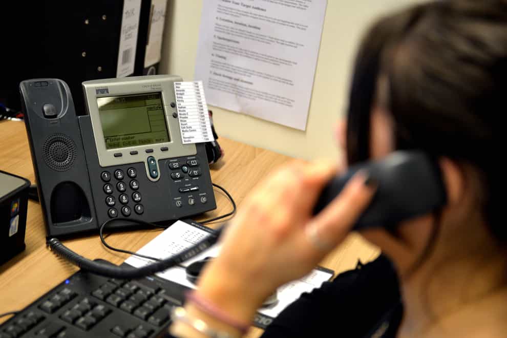 An office employee on the telephone