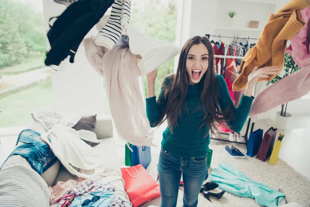 Woman screaming at a cluttered room