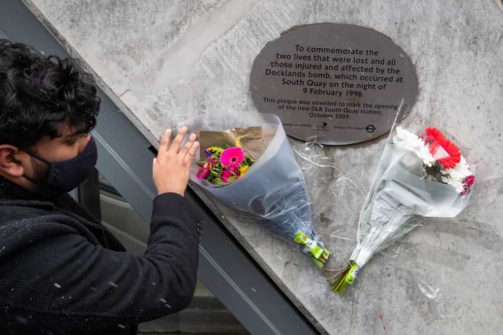 Flowers next to the plaque commemorating victims of the 1996 IRA Docklands bombing