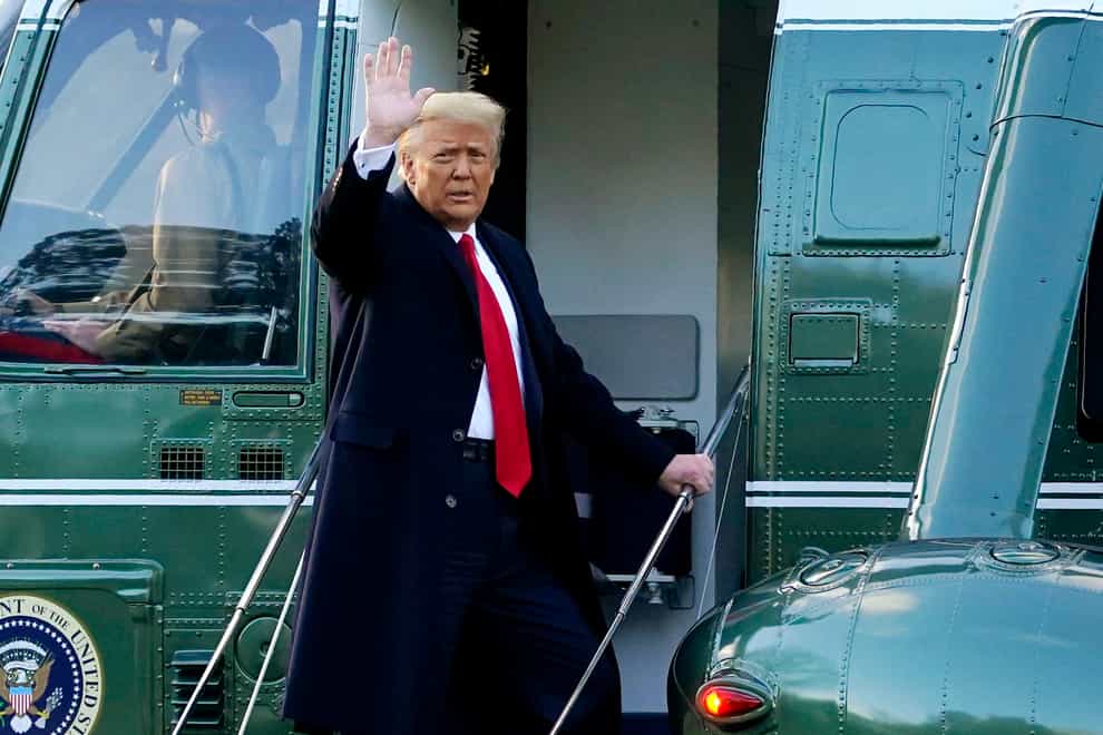 Donald Trump waves as he boards Marine One