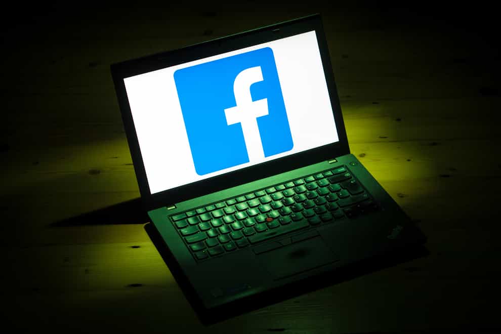 The logo of social networking site Facebook is displayed on a laptop