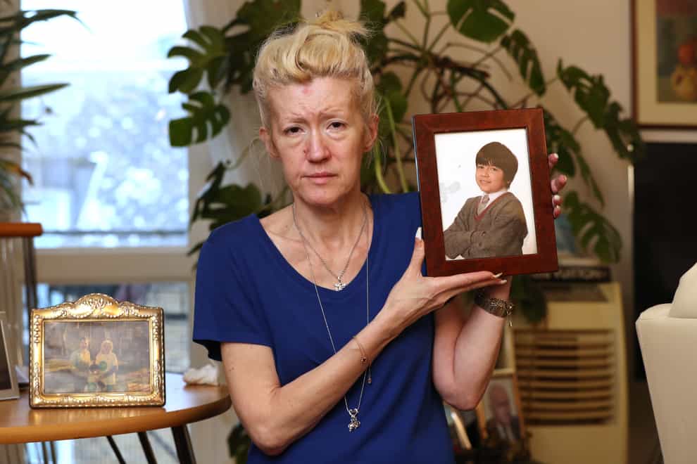 Jasna Badzak holding a 2014 photograph of her son Sven