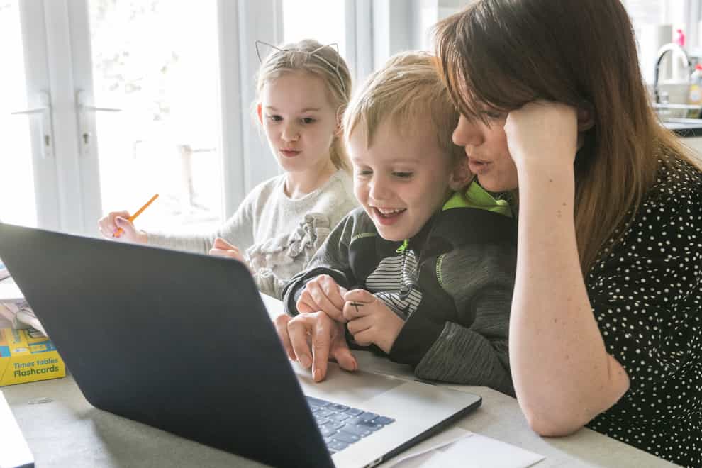 A mother and children using a laptop