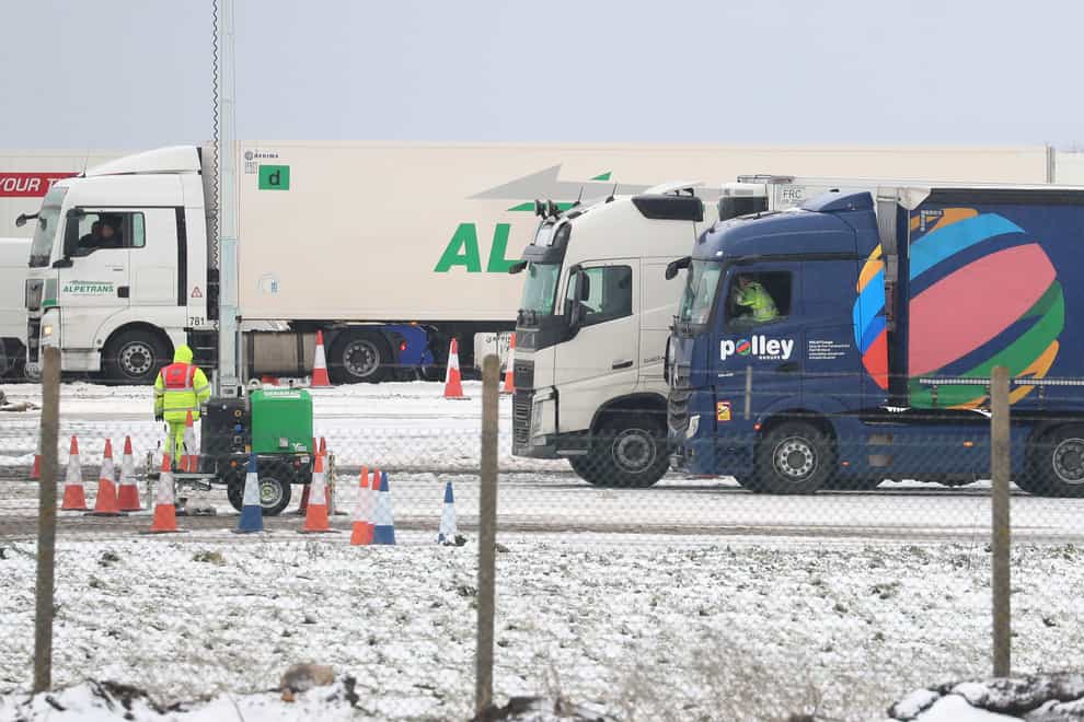Lorry drivers wait to be tested for Covid-19 at Manston in Kent