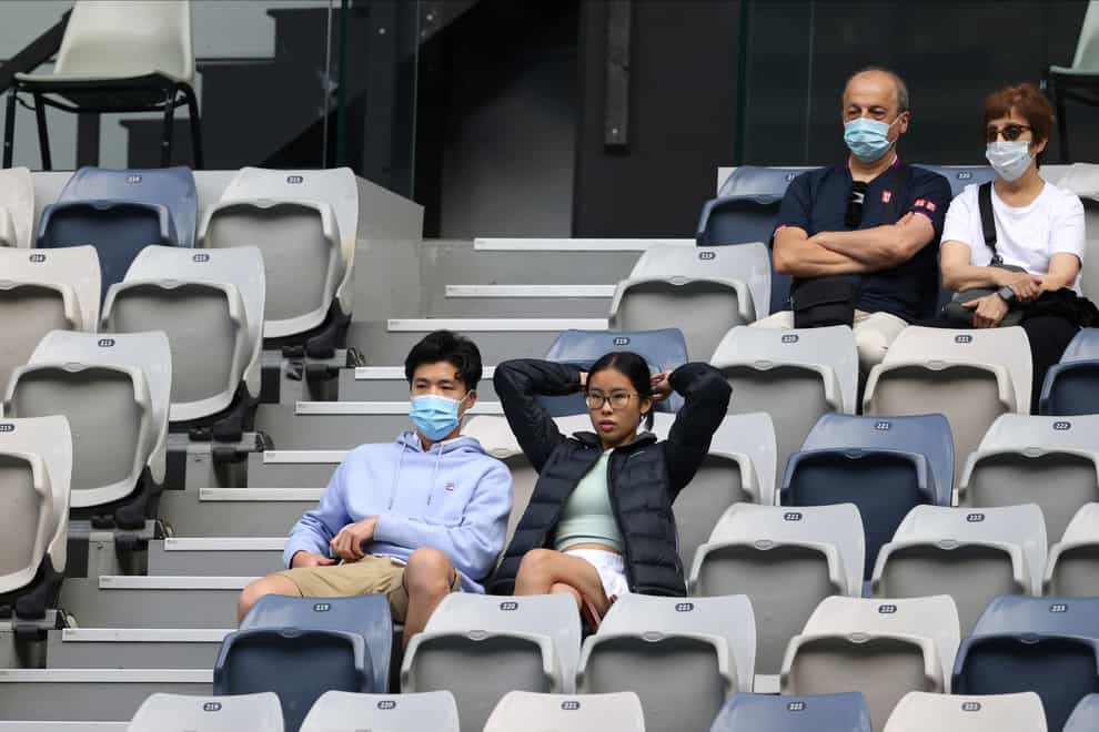 Spectators watch third round matches at the Australian Open tennis championship in Melbourne