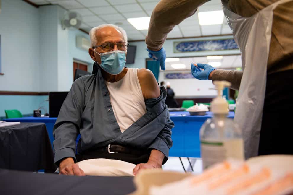 A man receives a coronavirus jab
