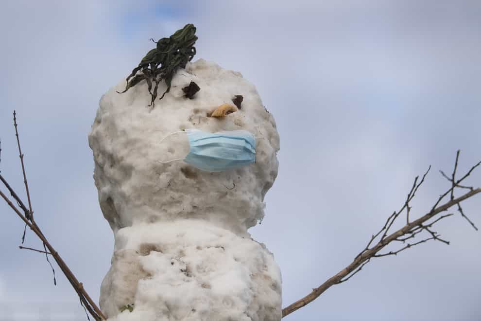 A snowman wearing a facemask in Southend-on-Sea