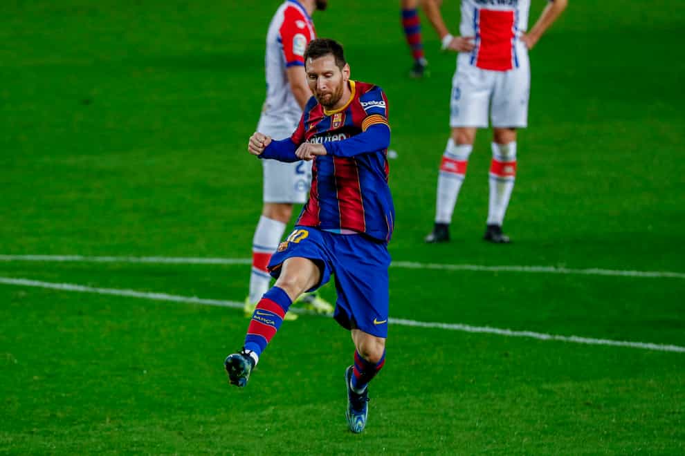 Lionel Messi celebrates after scoring his side’s second goal against Alaves
