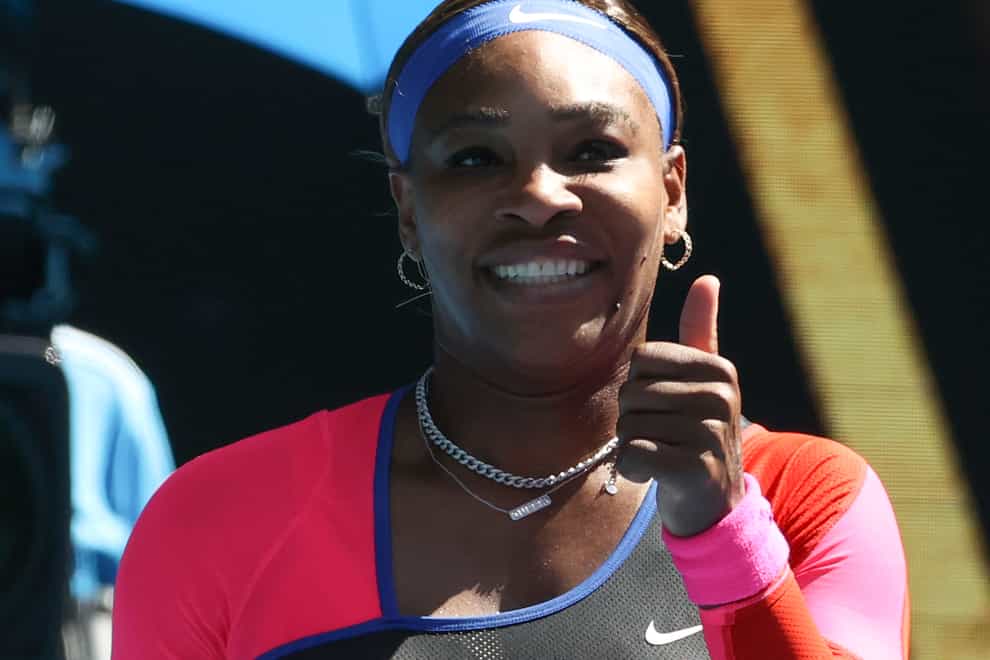 Serena Williams gives a thumbs up after beating Aryna Sabalenka