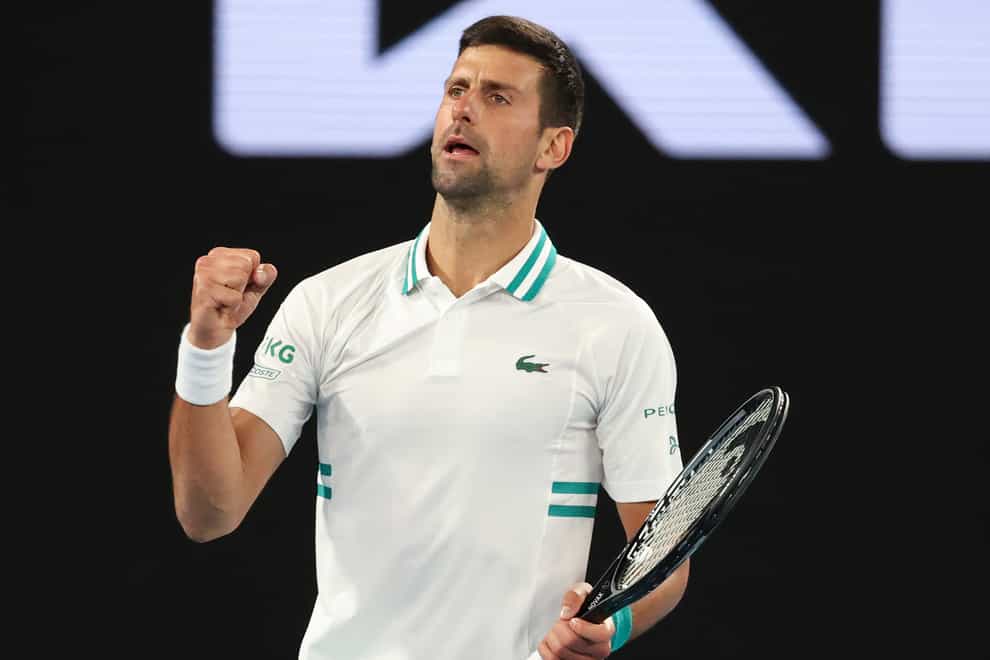 Novak Djokovic clenches his fist after beating Milos Raonic
