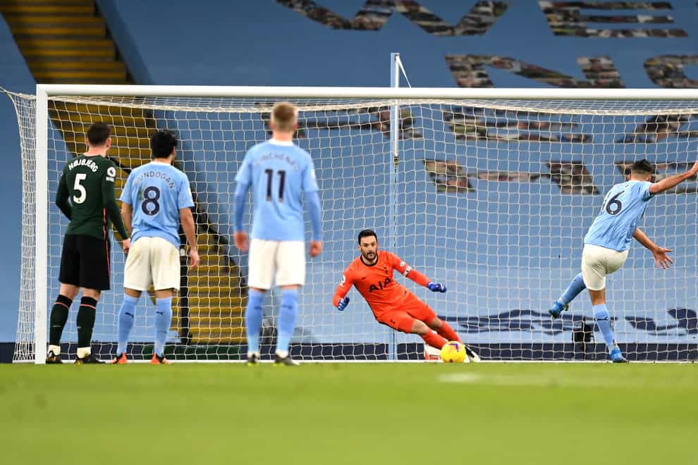 Manchester City’s Rodri (right) opens the scoring against Tottenham from the penalty spot