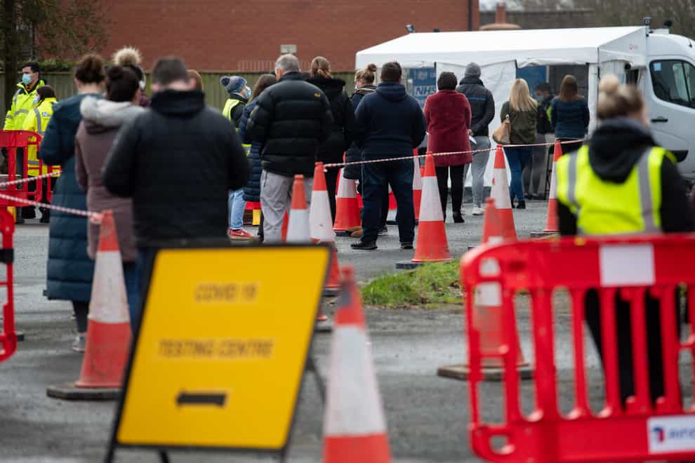 People queue at a mobile testing unit