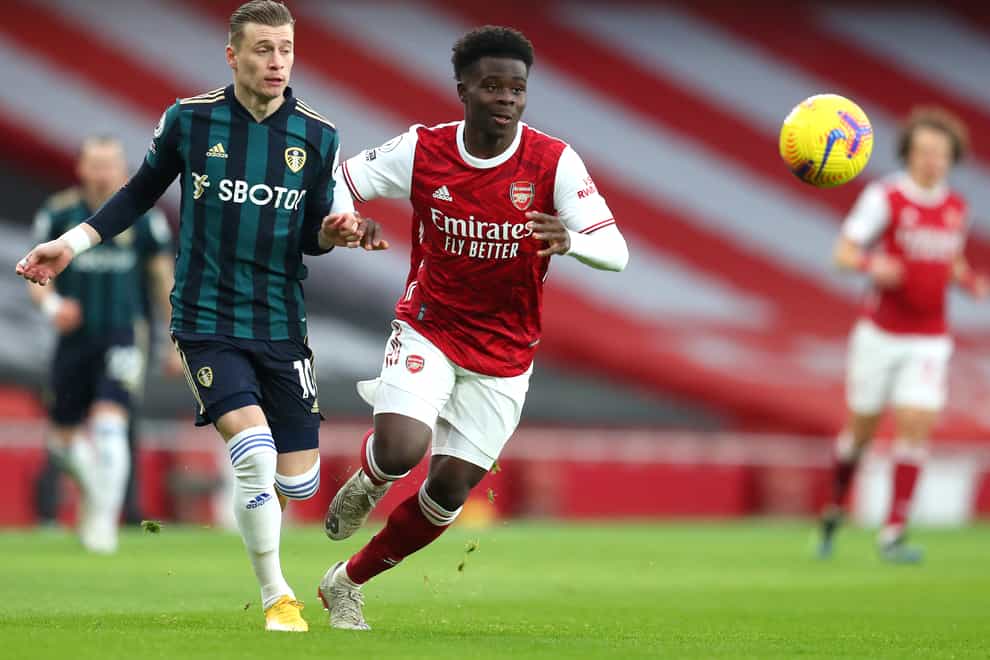 Arsenal's Bukayo Saka (right) says Mikel Arteta's is selecting the perfect mix of Arsenal youth and experience.