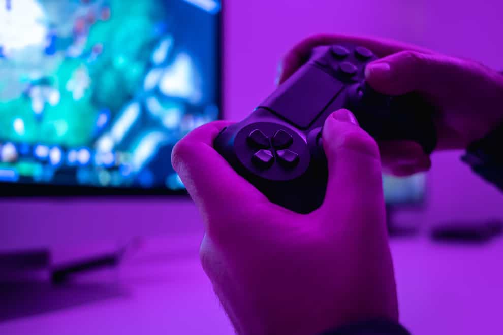 Closeup of hands with a controller