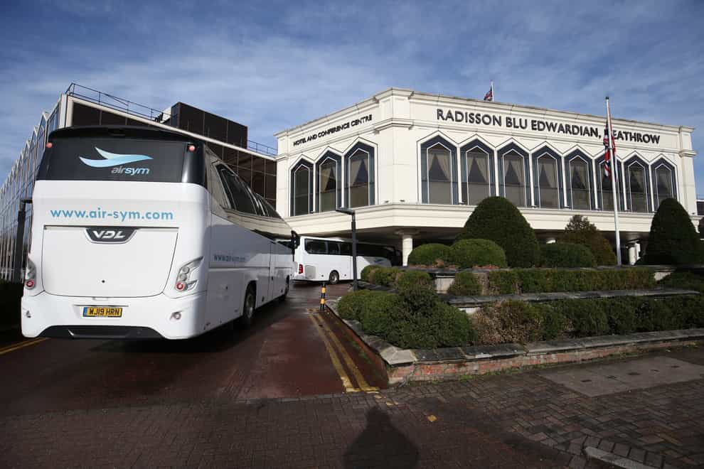 A coach carrying passengers arrives at the Radisson Blu Edwardian Hotel, near Heathrow Airport