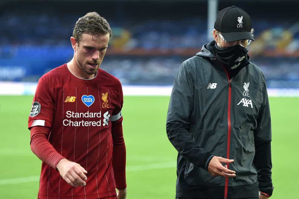Jordan Henderson, left, is eager to take some of the burden off Jurgen Klopp's shoulders at Liverpool (Peter Powell/NMC Pool/PA)
