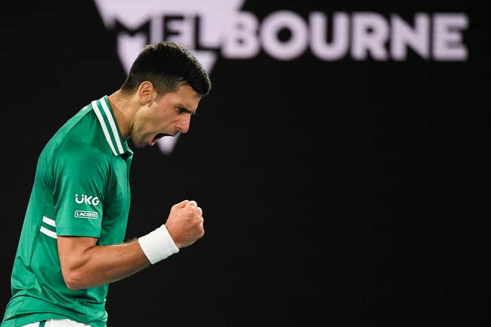 Novak Djokovic clenches his fist during his victory over Alexander Zverev