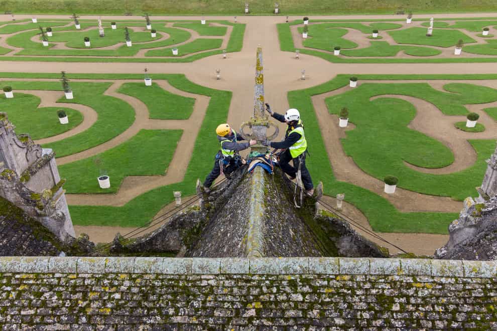 Stonemasons James Preston and John Fowler from SSH Conservation survey Kirby Hall in Corby, Northamptonshire