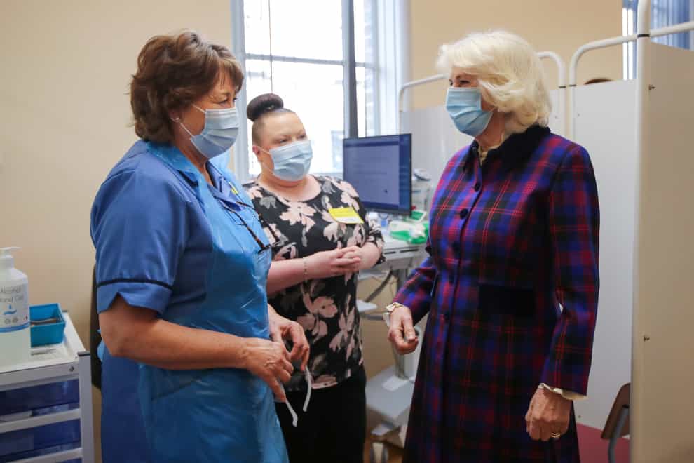 The Duchess of Cornwall speaks with members of staff during a visit to the Queen Elizabeth Hospital in Birmingham