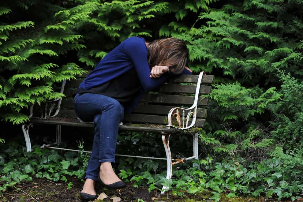 A woman showing signs of fatigue