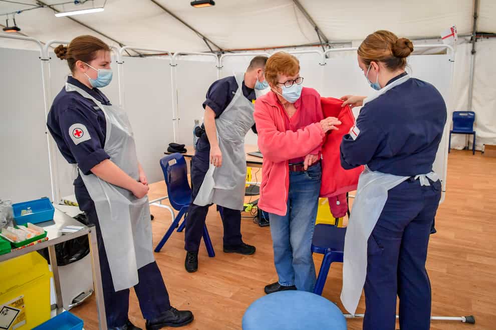 Royal Navy personnel give vaccines to the public at Bath Racecourse