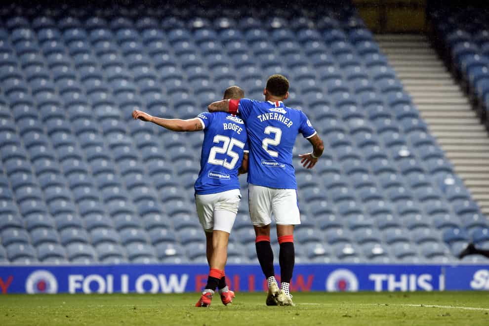 James Tavernier and Kemar Roofe in action